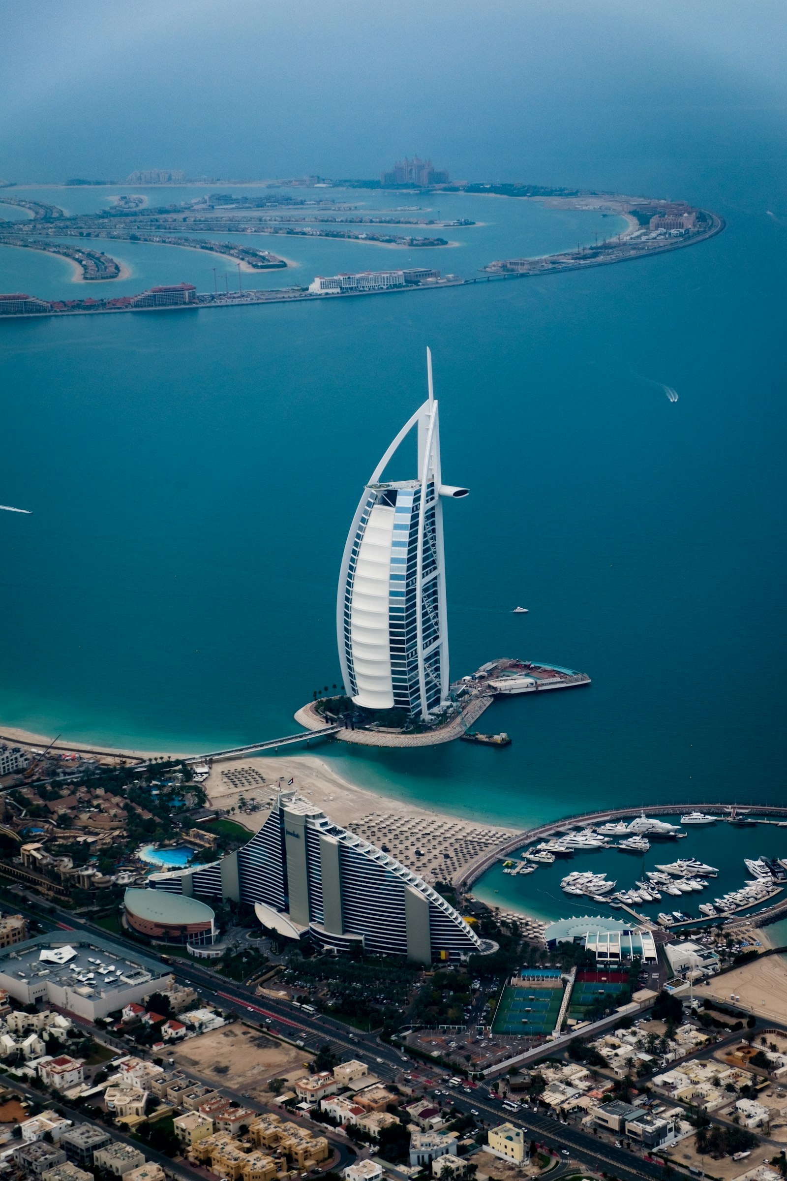 Dubai skyline at dusk with illuminated towers