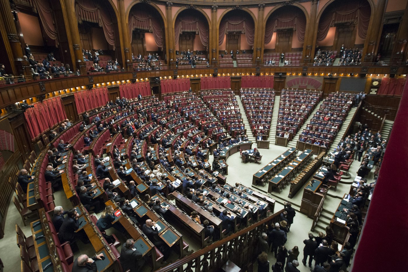 Legislative assembly chamber with benches and microphones